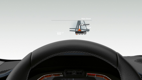 BMW 3er Limousine, BMW Head-Up Display Frontale Nahaufnahme des halben Lenkrades und der Frontscheibe der BMW 3er Limousine mit BMW Head-Up Display.