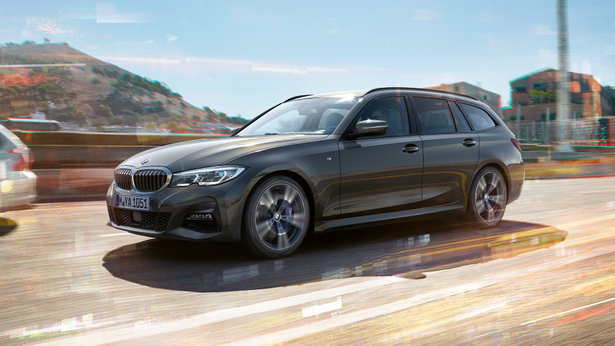 BMW M340i xDrive Touring en marche, prise de vue latérale G21