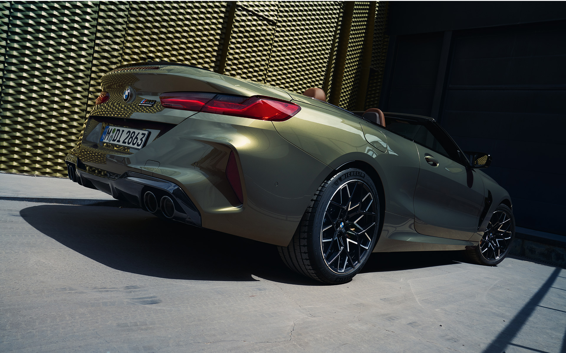 BMW M8 Competition Convertible F91 LCI Facelift 2022 BMW Individual Brass metallic three-quarter rear view low angle shot