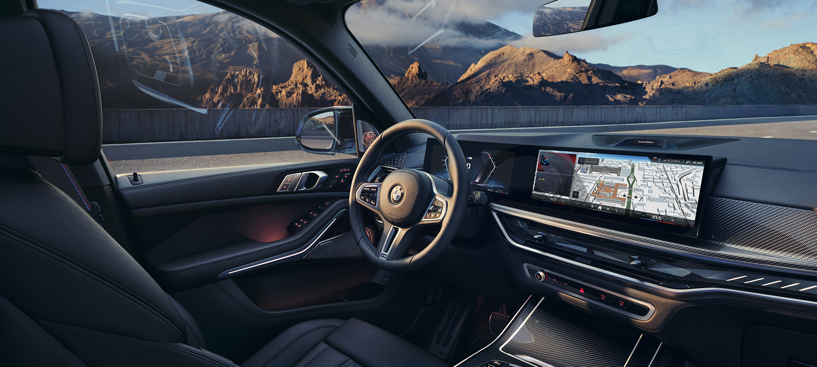BMW X7 M60i G07 LCI – poste de conduite intérieur BMW X7 M60i G07 LCI devant un paysage de montagne – poste de conduite intérieur